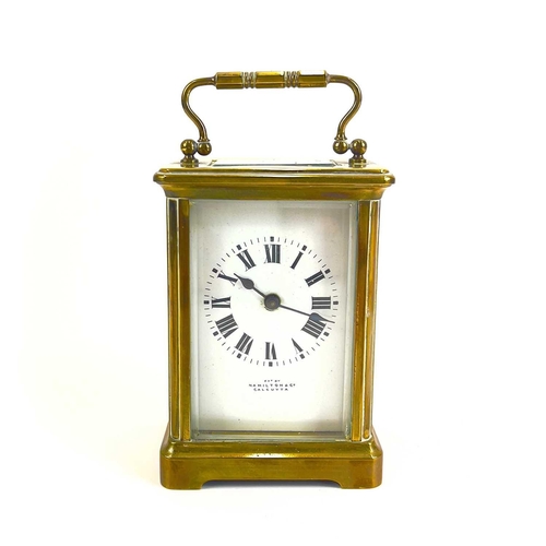 1710 - A French brass cased carriage timepiece, retailed by Hamilton & Co, Calcutta. Early 20th century, wi... 