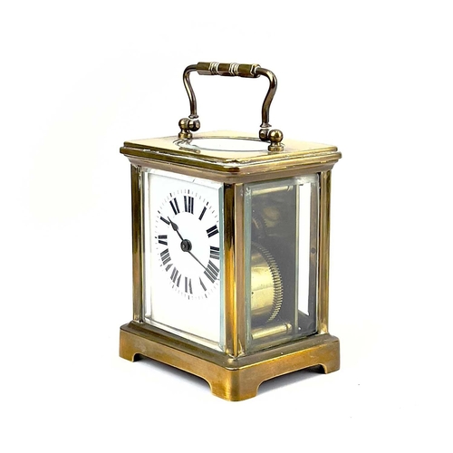 1712 - A French brass cased carriage timepiece. Early 20th century, the base stamped CH, height 10.5cm.