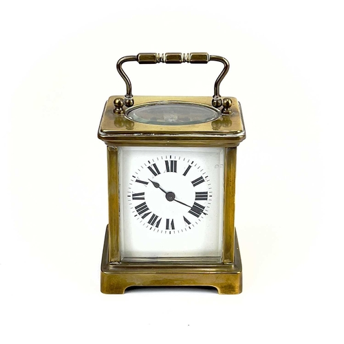 1712 - A French brass cased carriage timepiece. Early 20th century, the base stamped CH, height 10.5cm.