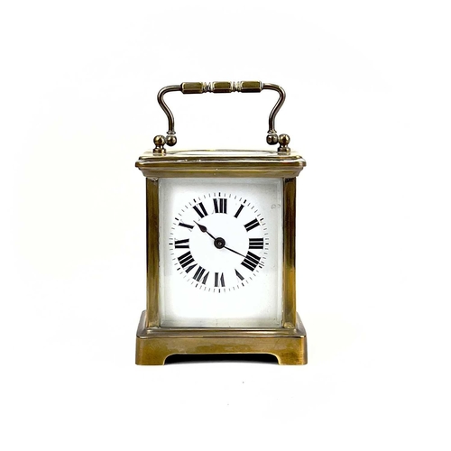 1712 - A French brass cased carriage timepiece. Early 20th century, the base stamped CH, height 10.5cm.