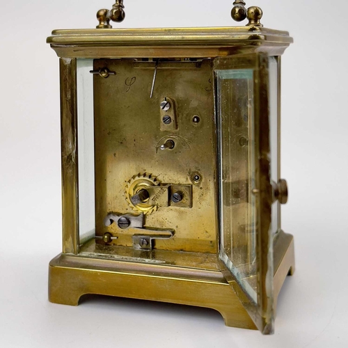 1712 - A French brass cased carriage timepiece. Early 20th century, the base stamped CH, height 10.5cm.