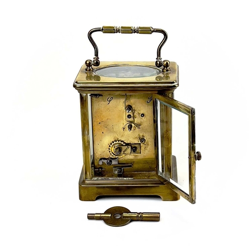 1712 - A French brass cased carriage timepiece. Early 20th century, the base stamped CH, height 10.5cm.