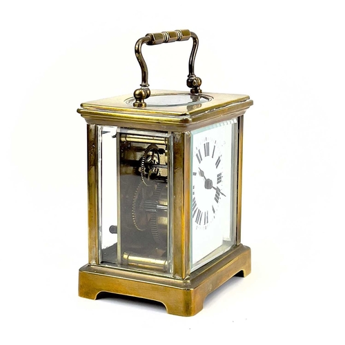 1712 - A French brass cased carriage timepiece. Early 20th century, the base stamped CH, height 10.5cm.