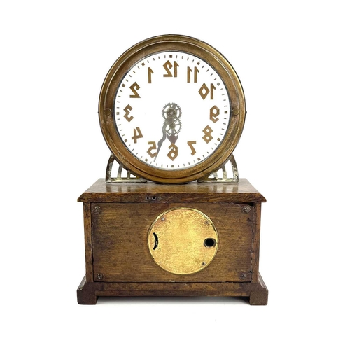 1713 - An American La Mysterieuse oak and brass cased mystery mantel clock. Circa 1910, the glass dial with... 