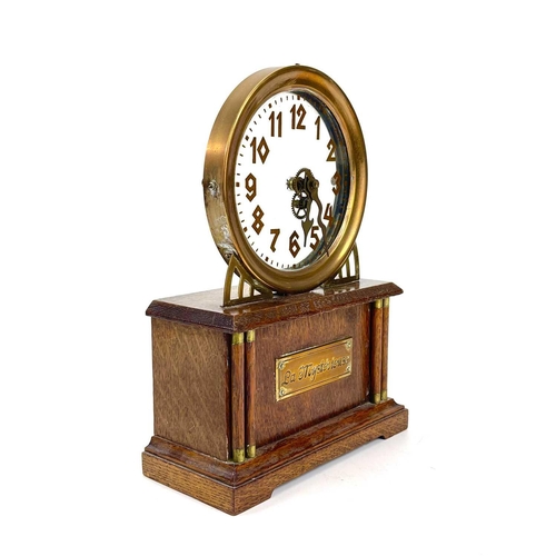 1713 - An American La Mysterieuse oak and brass cased mystery mantel clock. Circa 1910, the glass dial with... 