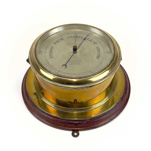 1715 - A Benson brass marine aneroid barometer. Circa 1900, the silvered dial stamped Compensated Benson Lu... 