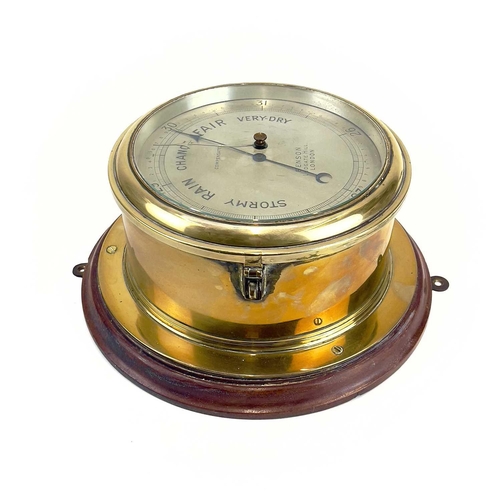 1715 - A Benson brass marine aneroid barometer. Circa 1900, the silvered dial stamped Compensated Benson Lu... 