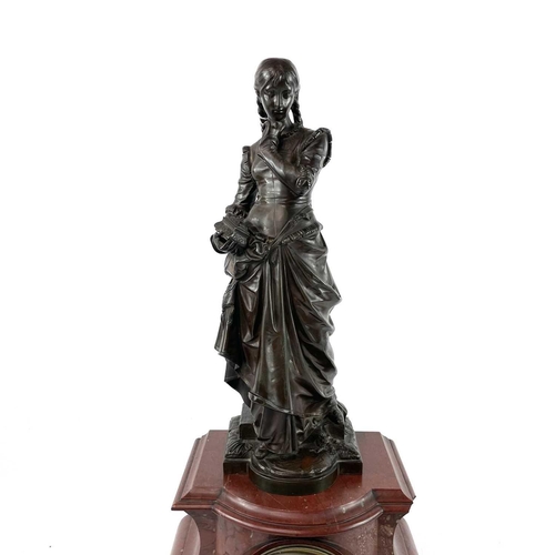 1719 - A 19th century French red marble mantle clock with a bronze figure of girl holding a small casket Si... 