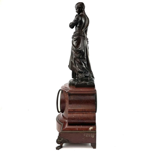 1719 - A 19th century French red marble mantle clock with a bronze figure of girl holding a small casket Si... 