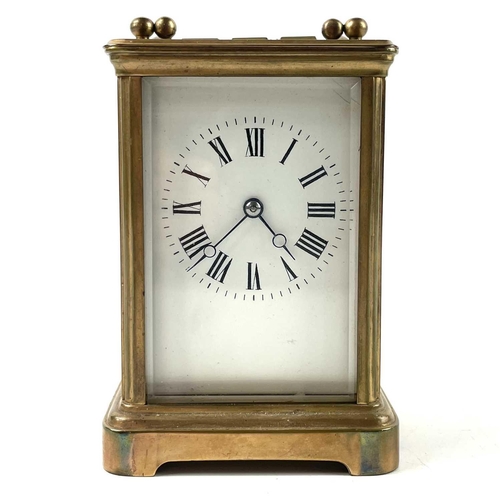 1722 - A French brass carriage clock. Striking on a coiled gong, leather case, height 13.5cm.