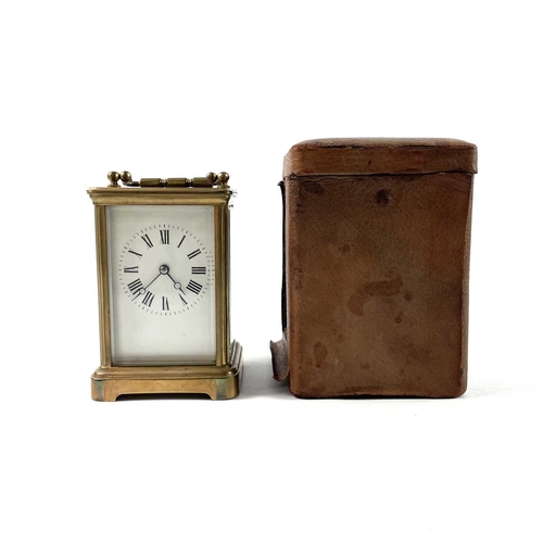 1722 - A French brass carriage clock. Striking on a coiled gong, leather case, height 13.5cm.