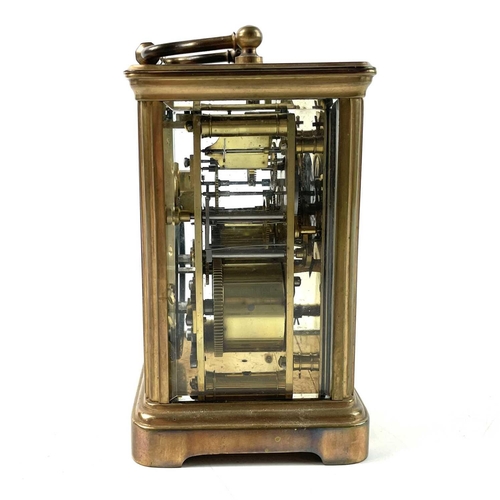 1722 - A French brass carriage clock. Striking on a coiled gong, leather case, height 13.5cm.