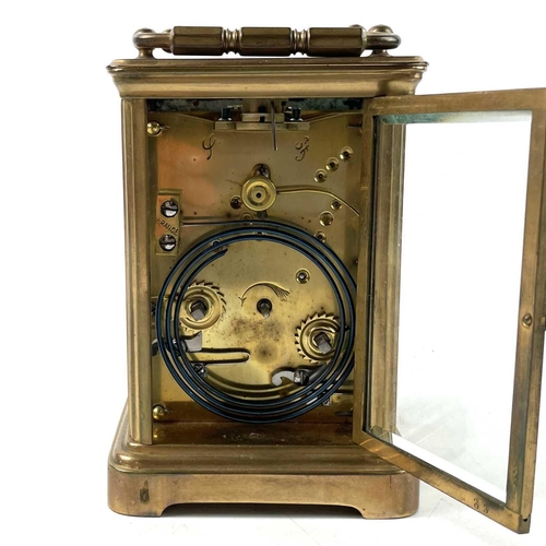 1722 - A French brass carriage clock. Striking on a coiled gong, leather case, height 13.5cm.