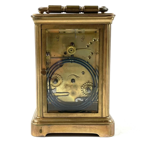 1722 - A French brass carriage clock. Striking on a coiled gong, leather case, height 13.5cm.