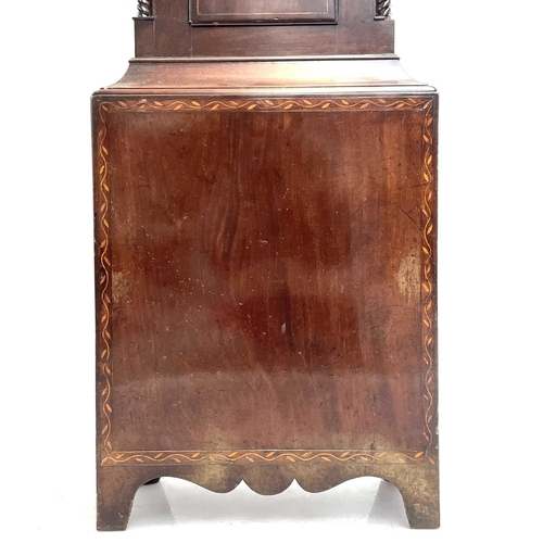 1726 - A mahogany, crossbanded and inlaid eight-day longcase clock. Circa 1800, with arched painted dial, e... 