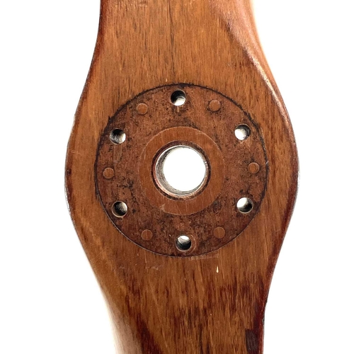 18 - A 20th century laminated wood propeller. The hub is stamped 62 40 508 153412 87, length 157.5cm.