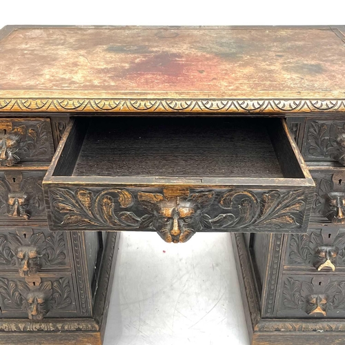 1801 - A Victorian oak twin pedestal writing desk. With inset leather skiver above a central long drawer an... 