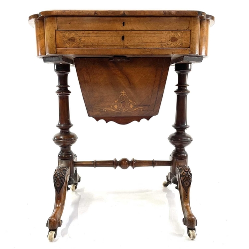 1803 - A Victorian walnut and inlaid work/writing table. The hinged top revealing an adjustable writing slo... 