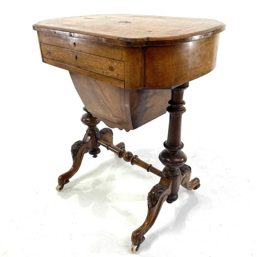 1803 - A Victorian walnut and inlaid work/writing table. The hinged top revealing an adjustable writing slo... 