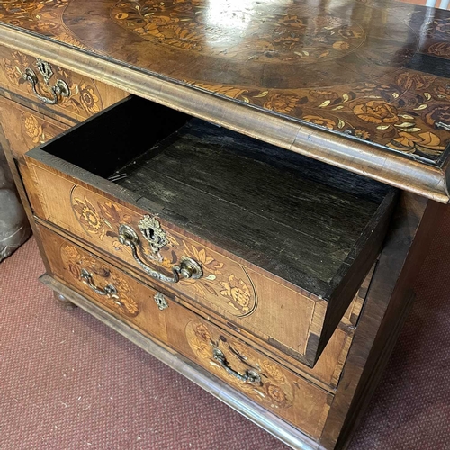 1805 - A William and Mary walnut and marquetry chest. The top inlaid with a flower filled urn flanked by ch... 