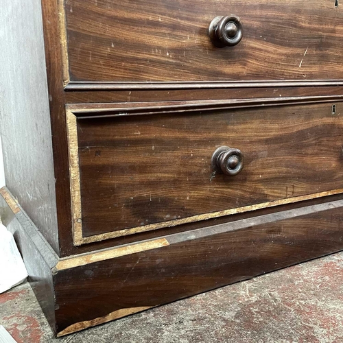 1806 - A late George III mahogany linen press. The upper part with two well figured doors enclosing five sl... 