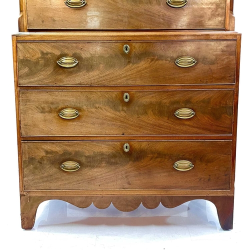 1809 - A late George III mahogany chest on chest. The upper part with an angular cornice above two short an... 