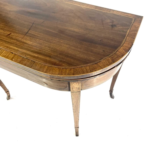 1818 - A George III mahogany and rosewood banded fold top card table. Raised on square taper legs with spla... 