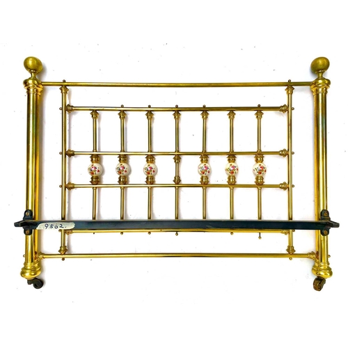 1819 - A Victorian style brass bed head and end. The rails with floral printed ceramic dividers, to take a ... 