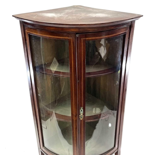 1831 - A late Victorian mahogany and inlaid bow front corner display cabinet. With an under tier and raised... 