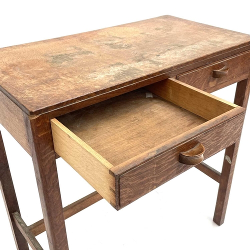 1833 - An oak Arts & Crafts side table. Fitted with two drawers and raised on square legs with stretchers. ... 