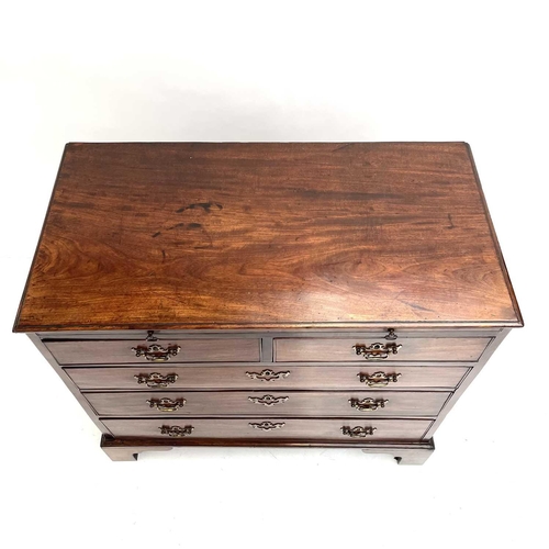 1835 - A George II mahogany chest. With a brushing slide, above two short and three long graduated drawers,... 