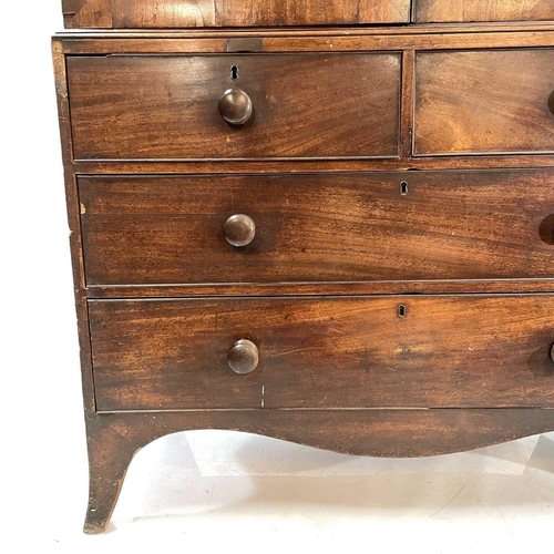 1836 - A George III mahogany linen press. The upper part with two oval panel doors enclosing sliding shelve... 