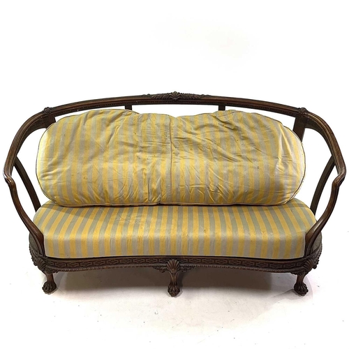 1841 - A walnut French settee. Circa 1900, with carved decoration, on paw feet, height 83cm, width 170cm, d... 