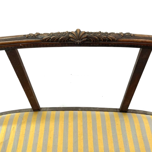 1841 - A walnut French settee. Circa 1900, with carved decoration, on paw feet, height 83cm, width 170cm, d... 