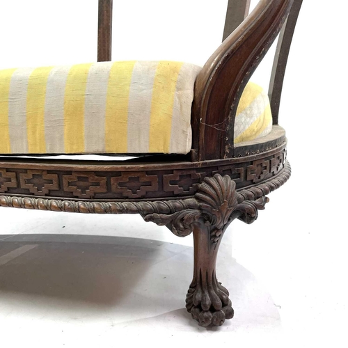 1841 - A walnut French settee. Circa 1900, with carved decoration, on paw feet, height 83cm, width 170cm, d... 