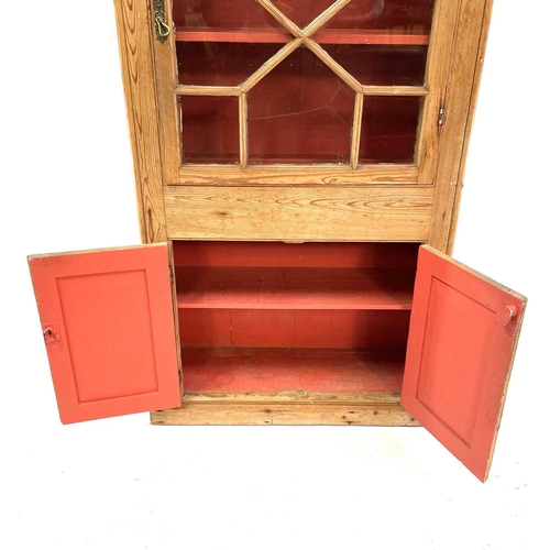 1842 - A Victorian pine display cabinet. The upper part with astragal glazed door enclosing three shelves, ... 