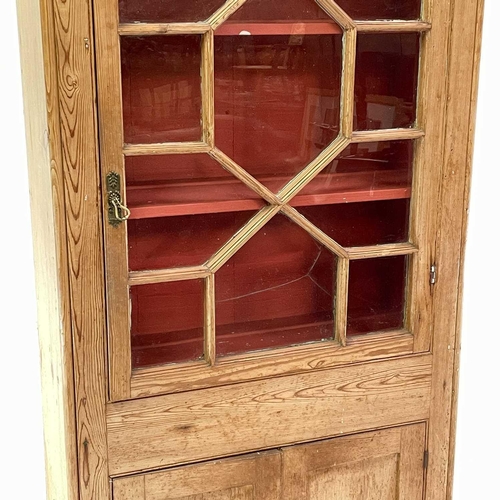 1842 - A Victorian pine display cabinet. The upper part with astragal glazed door enclosing three shelves, ... 