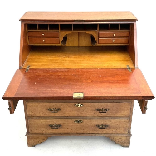 1846 - A mahogany writing bureau. Circa 1850, with fall front and fitted with four long drawers on bracket ... 