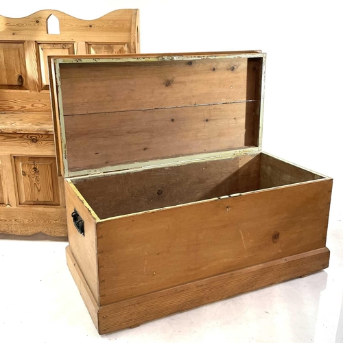 1847 - A pine settle and a blanket box. The former with raised back and hinged seat containing a storage co... 