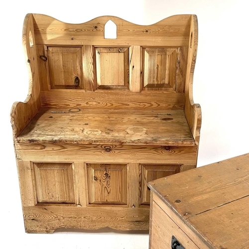 1847 - A pine settle and a blanket box. The former with raised back and hinged seat containing a storage co... 