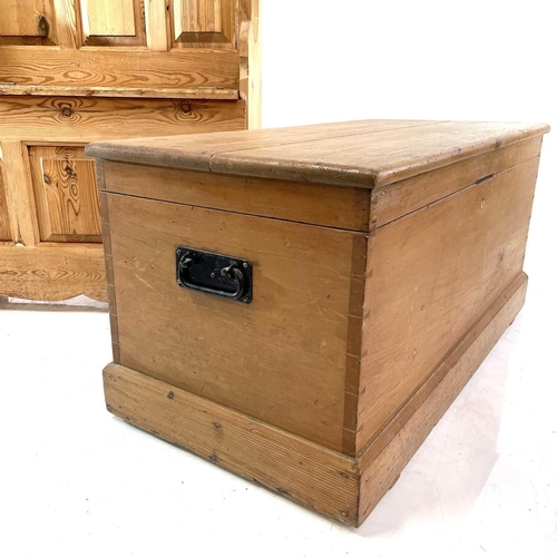 1847 - A pine settle and a blanket box. The former with raised back and hinged seat containing a storage co... 