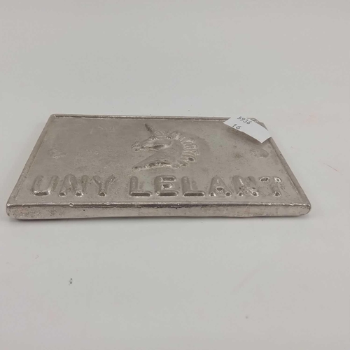 185 - A Cornish tin ingot. Cast with the inscription 'UNY LELANT' and a unicorn's head motif. 8.25cm x 12.... 