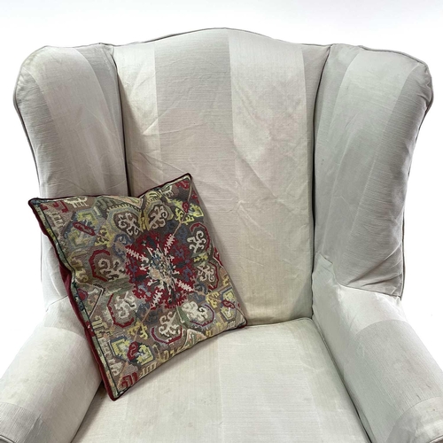 1850 - A Georgian style wing armchair. 20th century, with loose cover and raised on moulded square front le... 