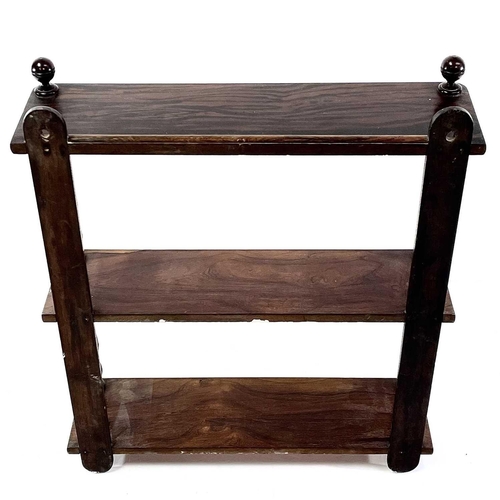 1851 - A Victorian rosewood and simulated rosewood wall shelf. The three shelves with baluster turned front... 