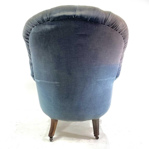 1852 - A Victorian walnut framed button back upholstered armchair. Raised on turned front legs and castors,... 