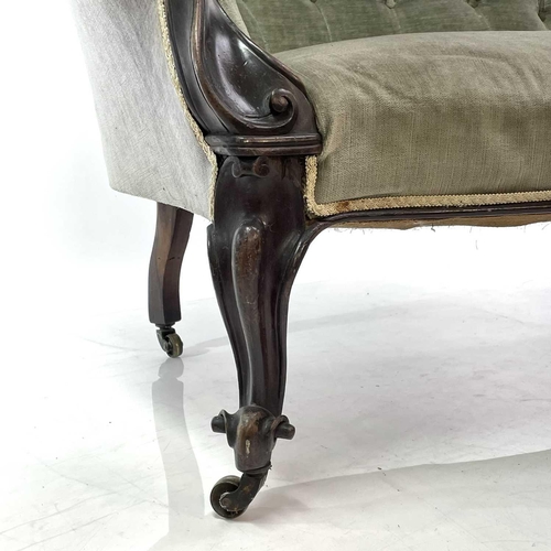 1853 - A late Victorian upholstered button back chaise lounge Walnut frame carved with scrolls on castor wh... 