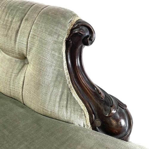 1853 - A late Victorian upholstered button back chaise lounge Walnut frame carved with scrolls on castor wh... 