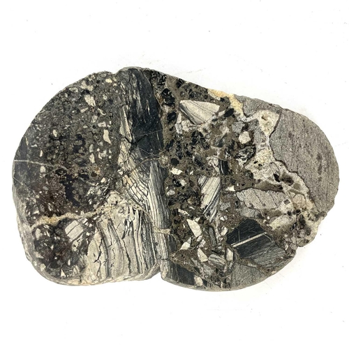 186 - Three cut cassiterite specimens from Trevaunance Cove, St Agnes. Accompanied by a modern bar ingot o... 