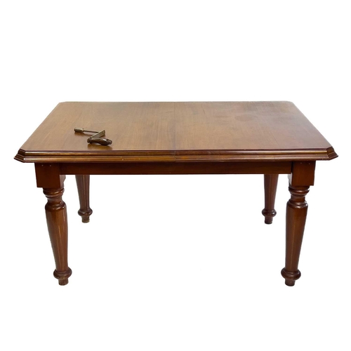 1861 - A late Victorian mahogany extending dining table. With wind-out action and an extra leaf, on turned ... 