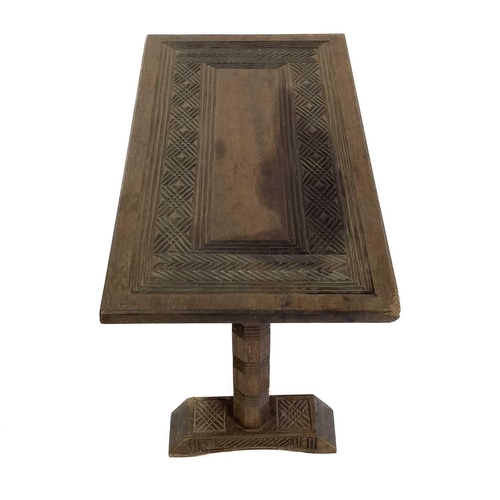 1864 - An African hardwood rectangular coffee table. Probably Nigeria, with carved geometric design to the ... 